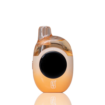 A compact, rounded vape device with a translucent amber top and a warm orange-to-cream gradient body, featuring a large black circular mouthpiece and a small 'UT' logo near the base, set against a clean white background with a soft reflection below.