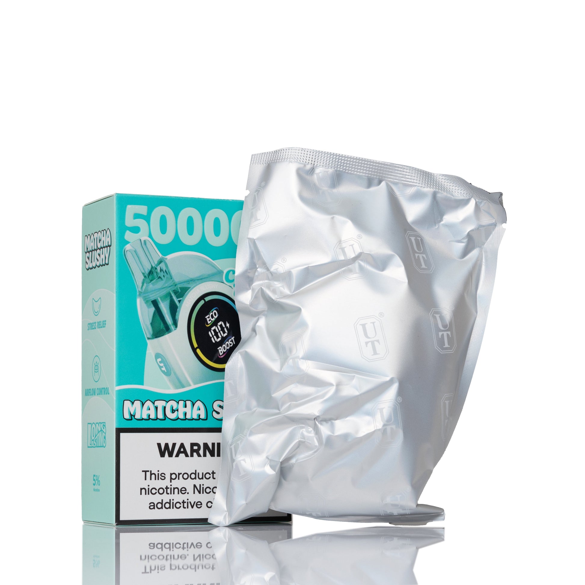 A silver foil pouch of nicotine pouches stands in front of its teal and white retail box on a clean white background. The box reads '5000' and 'MATCHA SLUSHI' with a nicotine strength display graphic and a nicotine warning label.